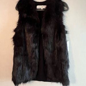 Black fur vest knit on back of vest no buttons